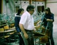Moving into new building - 1979.  Bruce and Darlene Young and daughter.  Desks were bought at auction from Mhd Jr High School.